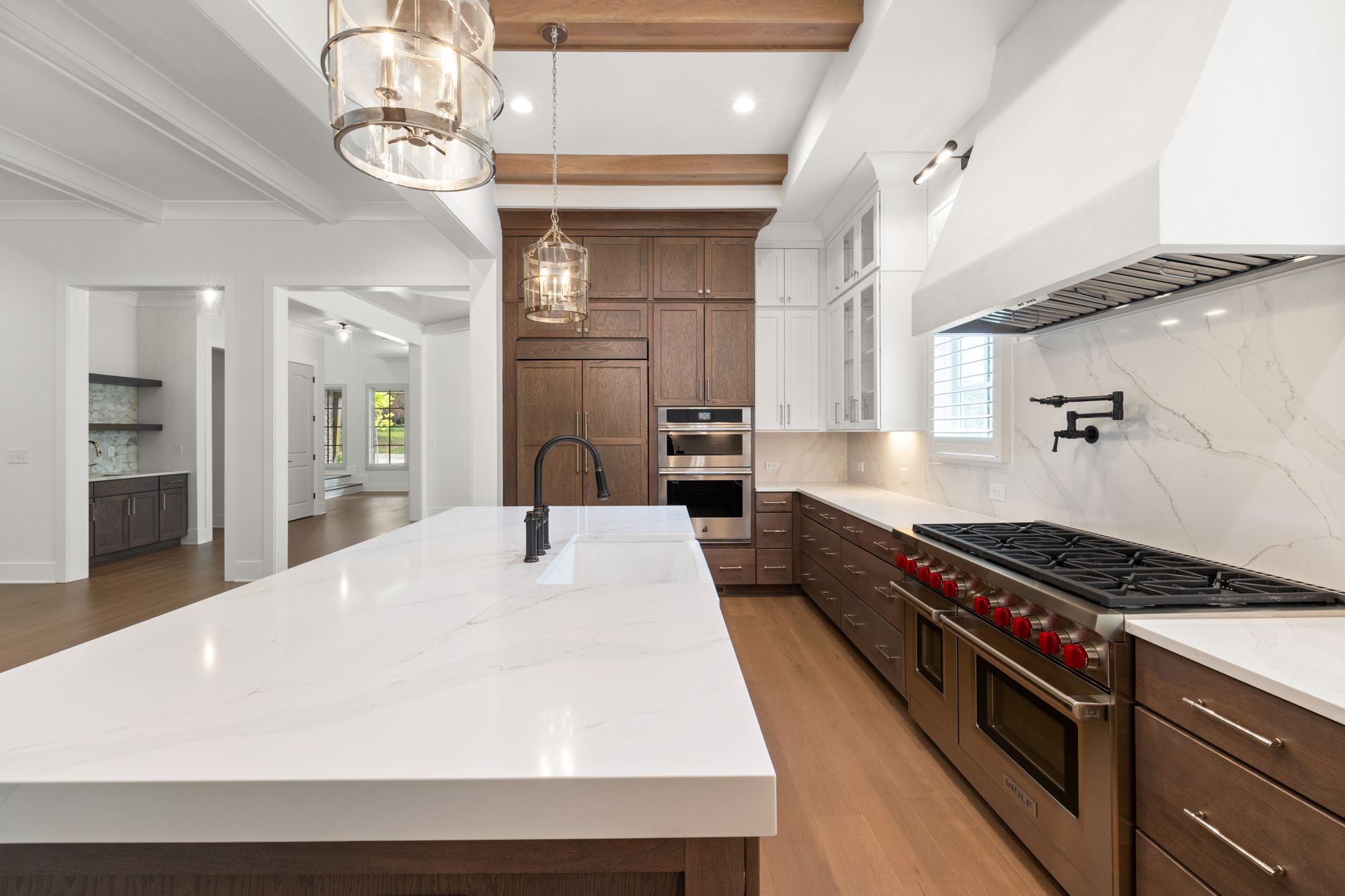 Modern kitchen remodeling with marble countertops stainless steel appliances and hardwood floors serving Austin Round Rock…